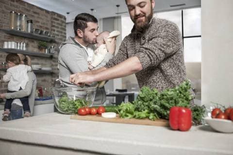 Family and friends preparing a healthy meal in kitchen model released Symbolfoto property released  ZEF14466
