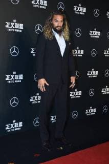 American actor and model Jason Momoa poses as he arrives on the red carpet for the movie Justice League in Beijing, China, 26 October 2017. Gal Gadot, Ben Affleck, and Henry Cavill team up to endorse film Justice League in Beijing  pbu701196_17