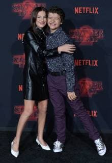 Cast members Millie Bobby Brown and Gaten Matarazzo attend the premiere of Netflix s Stranger Things Season 2 at the Regency Bruin Theatre in Los Angeles on October 26, 2017. Storyline: When a young boy disappears, his mother, a police chief, and his friends must confront terrifying forces in order to get him back.  LAP2017102635 JIMxRUYMEN