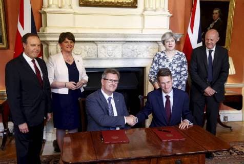 Gavin Williamson has been appointed the Defence Secretary after Michael Fallon had to resign after admitting touching a journalist s knee inappropriately in the past. . 26 06 2017. London, United Kingdom. The DUP s Jeffrey Donaldson and Gavin Williamson the Conservative Party Chief Whip sign paperwork after Prime Minister Theresa May and her colleagues met with the DUP leader Arlene Foster at No10 Downing Street in London after agreeing a deal to support the minority government.  xCPNAx xi-Imagesx IIM-16287-0009