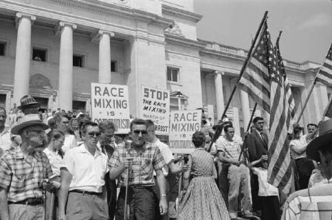 August 20 1959 A group of people rally in Washington D C several holding signs and American flags protesting the admission of the Little Rock Nine to Central High School  Copyright: StocktrekxImages STK501175A