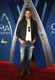 Chase Rice walks the red carpet as he arrives for the 51st Annual Country Music Association Awards on November 8, 2017 at the Bridgestone Arena in Nashville.  NAS20171108120 JOHNxSOMMERSxII