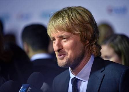Owen Wilson speaks with television reporters as he arrives for the premiere of Wonder at the Regency Village Theatre in Los Angeles on November 14, 2017.  LAP2017111444 CHRISTINExCHEW