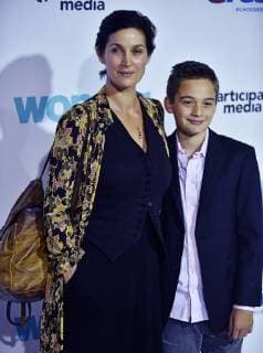 Carrie-Anne Moss and her son Jaden Roy arrive for the premiere of Wonder at the Regency Village Theatre in Los Angeles on November 14, 2017.  LAP2017111431 CHRISTINExCHEW