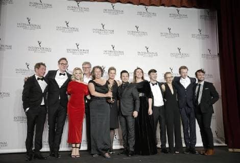 Helene Yorke, Beatrice Kramm and Lucia Haslauer, winners of the Short Form Series award for The Braun Family, and Freddy Rodriguez stand with an award at the 45th International Emmy Awards at the New York Hilton in New York City on November 20, 2017.  NYP20171120192 JOHNxANGELILLO