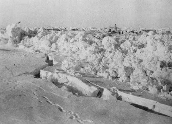 SS Chelyuskin , a Soviet steamship sent out on an expedition to navigate through polar ice along the Northern Maritime Route from Murmansk to Vladivostok , has became ice-bound in Arctic waters during navigation . It was caught in the ice fields in September. After that it drifted in the ice pack before sinking on February 13 , 1934, crushed by the icepacks near Kolyuchin Island in the Chukchi Sea . The crew managed to escape onto the ice and built a makeshift airstrip using only a few spades , ice shovels and two crowbars , which helped in the rescue of the crew . Fifty three men walked over the ice with stores on husky sleds . Photo shows ; an ice roller approaching the Schmidt camp . 24 March 1934, Russia Federation Copyright: Topfoto  UnitedArchivesEU038086