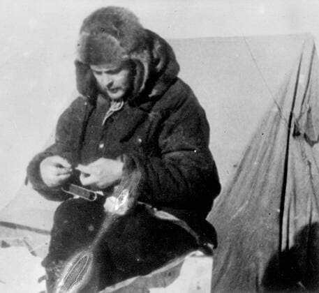 New pictures of Soviet scientist on ice floe, expedition rescued after drifting in Polar Seas. These pictures, just received in London, show the Soviet polar expedition on the North pole ice floe, in which they lived for nine months. Rescue expeditions succeeded in reaching the scientists as the ice crumbled beneath them and they are now on their way home. The expedition consisted of Ivan Papanin, (leader), Ernest Krenkel, radio operator, Pyotr Shirshov and Eugene Federov. Photo shows Pyotr Shirshov (Marine biologist) at the North Pole ice floe camp. 3 March 1938, Arctic Copyright: Topfoto  UnitedArchivesEU052982