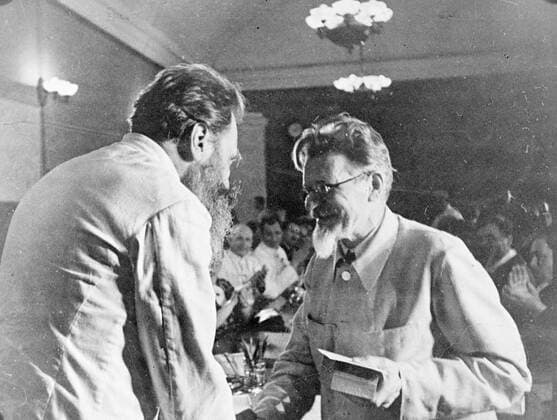 Professor Otto J. Schmidt (left) receiving the Order of Lenin and certificate of Hero of the Soviet Union from M. I. Kalinin, Soviet Premier , in Moscow. Other members of the expedition and workers of the chief administration of Northern Sea Routes, which organises Arctic expeditions also received awards. 12 July 1937, Moscow Russia Federation Copyright: Topfoto  UnitedArchivesEU054389