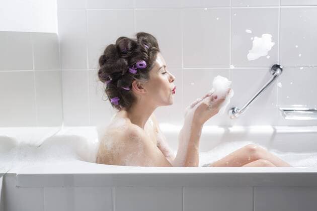 Young woman with curlers taking a bath model released Symbolfoto  PNEF00119