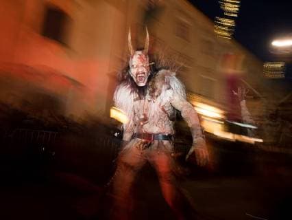 December 3, 2017 - Graz, Austria - A devil character seen running in the centre of Graz..Around December 6th, St. Nicolas Day, people dress up as devils run through streets of towns and villages in Austria. They seem like if they jumped out from a horror movie. Or from the hell. They are dressed in animal skins, have horns, strange instruments to scary people. Their faces are turned into nasty grins. They are covered with blood and scars and their long teeth dangle out of their mouths. Special tradition of a devil characters named krampus and percht who are coming with the St. Nicolas to punish bad people was born in remote valleys of Alp mountains hundreds years ago. Long winter nights were full of monsters. But at the end, krampus and percht were not just negative characters. They came to punish everything bad and prepare people - ZUMAs197 20171203_zab_s197_002 Copyright: xSOPAx