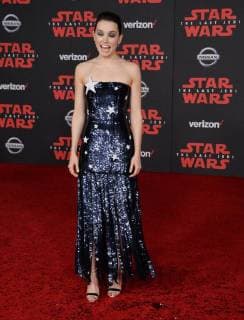 Cast member Daisy Ridley attends the premiere of the sci-fi motion picture fantasy Star Wars: The Last Jedi at the Shrine Auditorium in Los Angeles on December 9, 2017. Storyline: Having taken her first steps into the Jedi world, Rey joins Luke Skywalker on an adventure with Leia, Finn and Poe that unlocks mysteries of the Force and secrets of the past.  LAP2017120992 JIMxRUYMEN