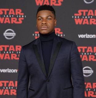 Cast member John Boyega attends the premiere of the sci-fi motion picture fantasy Star Wars: The Last Jedi at the Shrine Auditorium in Los Angeles on December 9, 2017. Storyline: Having taken her first steps into the Jedi world, Rey joins Luke Skywalker on an adventure with Leia, Finn and Poe that unlocks mysteries of the Force and secrets of the past.  LAP20171209201 JIMxRUYMEN