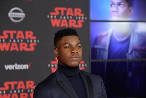 Cast member John Boyega attends the premiere of the sci-fi motion picture fantasy Star Wars: The Last Jedi at the Shrine Auditorium in Los Angeles on December 9, 2017. Storyline: Having taken her first steps into the Jedi world, Rey joins Luke Skywalker on an adventure with Leia, Finn and Poe that unlocks mysteries of the Force and secrets of the past.  LAP20171209203 JIMxRUYMEN