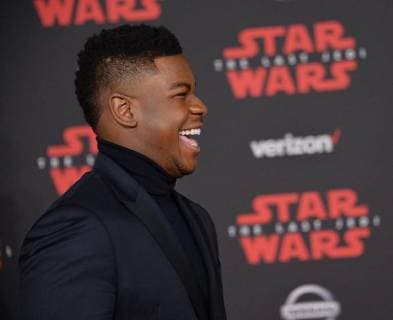 Cast member John Boyega attends the premiere of the sci-fi motion picture fantasy Star Wars: The Last Jedi at the Shrine Auditorium in Los Angeles on December 9, 2017. Storyline: Having taken her first steps into the Jedi world, Rey joins Luke Skywalker on an adventure with Leia, Finn and Poe that unlocks mysteries of the Force and secrets of the past.  LAP20171209205 JIMxRUYMEN