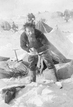 SS Chelyuskin , a Soviet steamship sent out on an expedition to navigate through polar ice along the Northern Maritime Route from Murmansk to Vladivostok , has became ice-bound in Arctic waters during navigation . It was caught in the ice fields in September. After that it drifted in the ice pack before sinking on February 13 , 1934, crushed by the icepacks near Kolyuchin Island in the Chukchi Sea . The crew managed to escape onto the ice and built a makeshift airstrip using only a few spades , ice shovels and two crowbars , which helped in the rescue of the crew . Fifty three men walked over the ice with stores on husky sleds . Photo shows ; Schmidt at his morning toilet . 1934, Russia Federation Copyright: Topfoto  !ACHTUNG AUFNAHMEDATUM GESCHÄTZT! UnitedArchivesEU038094
