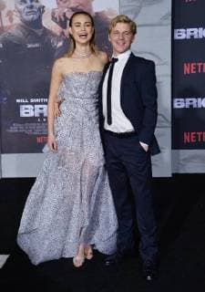 Cast member Lucy Fry and a guest attend the premiere of the sci-fi motion picture thriller Bright at the Regency Village Theatre in the Westwood section of Los Angeles on December 13, 2017. Storyline: Set in a world where mystical creatures live side by side with humans. A human cop is forced to work with an Orc to find a weapon everyone is prepared to kill for.  LAP2017121389 JIMxRUYMEN