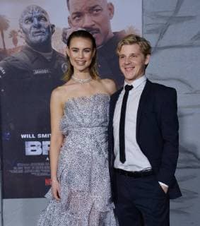 Cast member Lucy Fry and a guest attend the premiere of the sci-fi motion picture thriller Bright at the Regency Village Theatre in the Westwood section of Los Angeles on December 13, 2017. Storyline: Set in a world where mystical creatures live side by side with humans. A human cop is forced to work with an Orc to find a weapon everyone is prepared to kill for.  LAP2017121390 JIMxRUYMEN