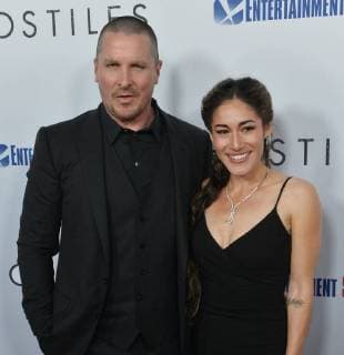 Cast members Christian Bale and Q orianka Kilcher attend the premiere of the motion picture western Hostiles at the Academy of Motion Picture Arts & Sciences in Beverly Hills, California on December 14, 2017. Storyline: In 1892, a legendary Army captain reluctantly agrees to escort a Cheyenne chief and his family through dangerous territory.  LAP2017121402 JIMxRUYMEN