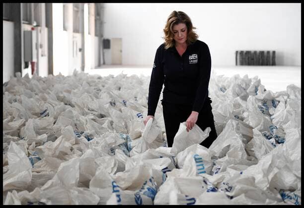 For Security Reasons Embargoed until 00.01 Monday 18th December 2017. Print and Online. . 16 12 2017. Djibouti, United Kingdom. Penny Mordaunt visits Djibouti. Penny Mordaunt , Secretary of State for International Development looking at bags of grain that are distributed to Yemen and the Horn Africa from the World Food Programme distribition Centre in Djibouti port. The UK is providing urgent new food and fuel supplies to help keep millions of Yemeni people alive as an escalation in fighting and restrictions on aid access threaten to push Yemen into a catastrophic famine, International Development Secretary Penny Mordaunt announced Monday 18th, December 2017. During a visit to a port in Djibouti from where UK aid is shipped to Yemen, Ms Mordaunt warned of the Òhuman tragedyÓ of the worldÕs worst humanitarian crisis, with over eleven  xAndrewxParsonsx xi-Imagesx IIM-16591-0051