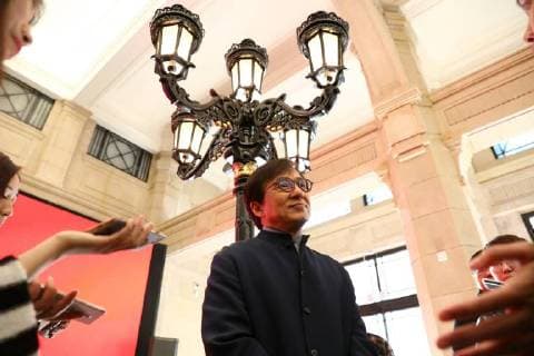 Hong Kong kungfu star Jackie Chan attends a ceremony to mark his donation of an antique street lamp and six replicas to the Shanghai History Museum in Shanghai, China, 17 December 2017. Jackie Chan on Sunday (17 December 2017) donated an antique street lamp and six replicas to the Shanghai History Museum. The 63-year-old film actor posed for pictures with one of the replicas during a ceremony at the museum at 325 Nanjing Road W. The original lamp is undergoing restoration, the museum said. Chan, a keen antiques collector outside his movie career, said he spotted a number of ornate street lamps on sale while filming in the United States many years ago. The Taiwan couple selling them said they were from Shanghai during the Republic of China (1912-1949) period. He bought 19 lamps from the couple at up to US$4,500 each and had them shipped  pbu726482_13