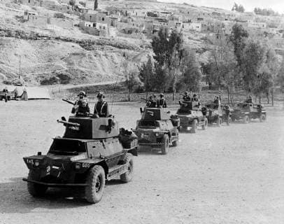 Latest reports from Palestine , following the end of the British mandate at midnight last night , say that Egyptian and Transjordan troops have invaded Palestine, and Syrian and Lebanese troops are poised on the borders. The actual invasions reported have begun several hours before Britain s mandate ended. Photo shows ; This picture shows the Arab legion troops on the move in tanks . 15 May 1948, Israel Copyright: Topfoto  !ACHTUNG AUFNAHMEDATUM GESCHÄTZT! UnitedArchives1379554