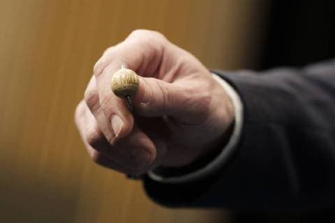 December 22, 2017 - Madrid, Spain - An official of the Spanish national lottery shows El Gordo (the fat one) winning ball of 4 million euros before the draw of Spain s Christmas lottery El Gordo (the Fat One) at the Royal Theatre in Madrid, on December 22, 2017. The first El Gordo lottery draw, yearly celebrated on December 22, took place in 1812 Madrid Spain  - ZUMAn230 20171222_zaa_n230_344 Copyright: xOscarxGonzalezx