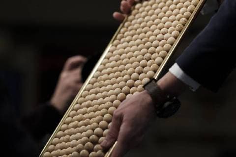 December 22, 2017 - Madrid, Spain - Officials check a ball bearing with the lottery ticket number of an spectator during the draw of Spain s Christmas lottery named El Gordo (Fat One) at the Teatro Real on December 22, 2017 in Madrid, Spain. The winning number wins a total of 4 million euros for the top prize to be shared between ten ticket holders Madrid Spain  - ZUMAn230 20171222_zaa_n230_350 Copyright: xOscarxGonzalezx