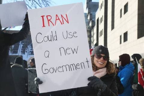 January 6, 2018 - Toronto, Ontario, Canada - Protestor holds a sign saying Iran could use a New Government as hundreds of Canadians take part in a protest against the Islamic Republic of Iran in Toronto, Ontario, Canada, on January 06, 2018. Protestors showed their solidarity with anti-government demonstrators in Iran and their support of a national uprising of the Iranian people. Protesters called for a regime change for social justice and freedom and democracy in Iran. There was a also a call that power in Iran be returned to Reza Pahlavi, the former Crown Prince of Iran and the last heir apparent to the defunct throne of the Imperial State of Iran and the current head of the exiled House of Pahlavi. Toronto Canada  - ZUMAn230 20180106_zaa_n230_1125 Copyright: xCreativexTouchxImagingxLtdx