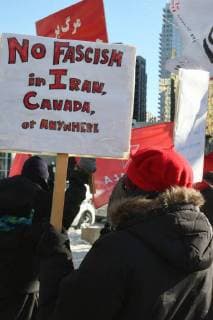 January 6, 2018 - Toronto, Ontario, Canada - Protestor holds a sign saying No Fascism in Iran, Canada, or anywhere as hundreds of Canadians take part in a protest against the Islamic Republic of Iran in Toronto, Ontario, Canada, on January 06, 2018. Protestors showed their solidarity with anti-government demonstrators in Iran and their support of a national uprising of the Iranian people. Protesters called for a regime change for social justice and freedom and democracy in Iran. There was a also a call that power in Iran be returned to Reza Pahlavi, the former Crown Prince of Iran and the last heir apparent to the defunct throne of the Imperial State of Iran and the current head of the exiled House of Pahlavi. Toronto Canada - ZUMAn230 20180106_zaa_n230_1122 Copyright: xCreativexTouchxImagingxLtdx