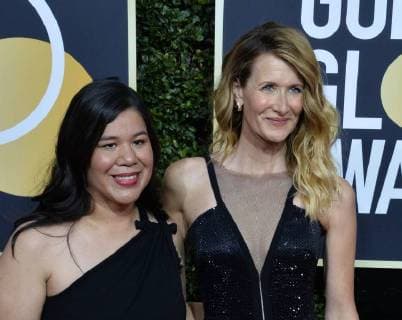 Actor Laura Dern (R) and activist Monica Ramirez attend the 75th annual Golden Globe Awards at the Beverly Hilton Hotel in Beverly Hills, California on January 7, 2018.  LAP20180107714 JIMxRUYMEN