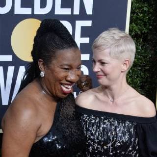 Activist Tarana Burke and actor Michelle Williams attend the 75th annual Golden Globe Awards at the Beverly Hilton Hotel in Beverly Hills, California on January 7, 2018.  LAP20180107843 JIMxRUYMEN