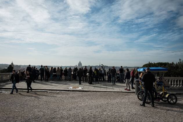 Tourists in the streets of Rome ROME, ITALY - JANUARY 04, Tourists around the historic center of Rome tourists from Pincio admire Rome on January 04, 2018 in Rome, Italy Rome Italy Italy  AndreaxRonchini
