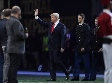 President Donald Trump arrives for the National Anthem before the first half of the NCAA College Football Playoff National Championship at Mercedes-Benz Stadium on January 8, 2018 in Atlanta.  CFP20180108318 DAVIDxTULIS