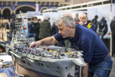 January 19, 2018 - London, London, UK - London, UK. Dave Fortey tends to his model of HMS Ark Royal (R09) at the London Model Engineering Exhibition at Alexandra Palace. Fortey, a former Royal Navy mechanic and sub-lieutenant, built the model over 25 years. It is the first time it has been put on display to the public. London UK  - ZUMAl94_ 20180119_zaf_l94_026 Copyright: xRobxPinneyx