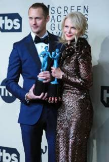 (180122) -- LOS ANGELES, Jan. 22, 2018 -- Alexander Skarsgard (L) with his Outstanding Performance by a Male Actor in a Television Movie or Limited Series award and Nicole Kidman with her Outstanding Performance by a Female Actor in a Television Movie or Limited Series award pose for photos at the 24th annual Screen Actors Guild (SAG) Awards at the Shrine Auditorium in Los Angeles, California, the United States, Jan. 21, 2018. ) (yk) U.S.-LOS ANGELES-SAG AWARDS LixYing 