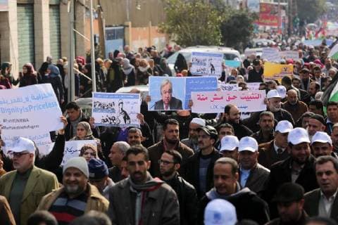 January 29, 2018 - Gaza City, Gaza Strip, Palestinian Territory - Palestinian employee of United Nations Relief and Works Agency (UNRWA) hold a sign during a protest against a U.S. decision to cut aid, in Gaza City January 29, 2018 Gaza City Palestinian Territory - ZUMAap3_ 20180129_zaf_ap3_080 Copyright: xAshrafxAmrax