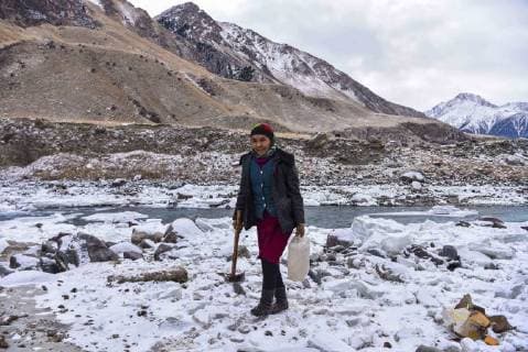 (180203) -- ILI, Feb. 3, 2018 -- A herder fetches water from a river in Akyaz Valley, Zhaosu County, northwest China s Xinjiang Uygur Autonomous Region, Jan. 15, 2018. About 130 kilometers from the nearest town, Akyaz Valley is an important winter grazing place for herders in Zhaosu County, Xinjiang. Despite an altitude of 2,000 meters, the Akyaz Valley has a warmer climate than surrounding areas and abundant grass and water. It is sometimes referred to as the valley of life. For centuries, herding has been an ancestral tradition for nomadic Kazakhs in Zhaosu. Migration begins in October, and more than 10,000 people drive 400,000 cattle and sheep to their winter homes, not leaving until May the next year. ) (wyo)(zt) CHINA-XINJIANG-AKYAZ VALLEY-WINTER GRAZING (CN) HuxHuhu 