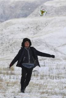 (180203) -- ILI, Feb. 3, 2018 -- Yeyeni, 14, plays football on the pasture in Akyaz Valley, Zhaosu County, northwest China s Xinjiang Uygur Autonomous Region, Jan. 16, 2018. He will spend the winter holidays with his parents at the valley. About 130 kilometers from the nearest town, Akyaz Valley is an important winter grazing place for herders in Zhaosu County, Xinjiang. Despite an altitude of 2,000 meters, the Akyaz Valley has a warmer climate than surrounding areas and abundant grass and water. It is sometimes referred to as the valley of life. For centuries, herding has been an ancestral tradition for nomadic Kazakhs in Zhaosu. Migration begins in October, and more than 10,000 people drive 400,000 cattle and sheep to their winter homes, not leaving until May the next year. ) (wyo)(zt) CHINA-XINJIANG-AKYAZ VALLEY-WINTER GRAZING (CN) 