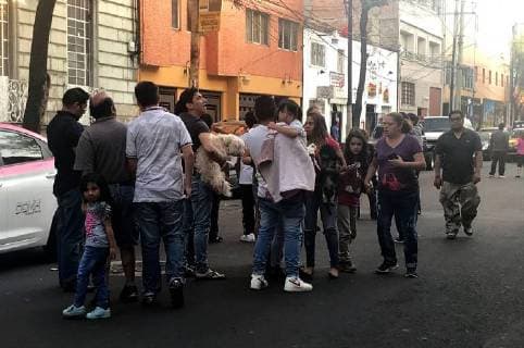 (180217) -- MEXICO CITY, Feb. 17, 2018 -- People gather on a street after a tremor was felt in Mexico City, capital of Mexico, on Feb. 16, 2018. A 7.1-magnitude earthquake hit Mexico at 7:39 a.m. Saturday (Beijing Time), according to the China Earthquake Networks Center (CENC). ) (gj) MEXICO-MEXICO CITY-QUAKE VANESSAxFERIA 