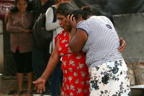 (180217) -- OAXACA (MOXICO), Feb. 17, 2018 -- Relative of helicopter accident victims cry in Santiago Jamiltepec of Oaxaca, Mexico, on Feb. 17, 2018. Thirteen people were killed after a military helicopter crashed on Friday in southern Mexico following an earthquake in the region, prosecutors in Oaxaca State said Saturday. The helicopter also carried Mexican Interior Minister Alfonso Navarrete and Governor of Oaxaca State Alejandro Murat, both of whom survived. ) (jg)(rtg) MEXICO-OAXACA-HELICOPTER-CRASH RebecaxMartinez 
