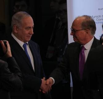February 18, 2018 - Munich, Bavaria, Germany - Benjamin Netanyahu and Wolfgang Ischinger shake hands. Israel s Prime Minister Benjamin Netanyahu spoke at the Munich Security Conference in Munich, Germany, on 18 February 2018. The MSC takes place from 16th to 18th February at the hotel Bayerischer Hof. Munich Germany  - ZUMAn230 20180218_zaa_n230_180 Copyright: xAlexanderxPohlx