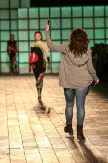 February 18, 2018 - London, United Kingdom - A woman seen protesting against the Fashion Week as models keep walking the runway at the Mary Katrantzou show during London Fashion Week February 2018 at BFC Show Space. London United Kingdom - ZUMAs197 20180218_zaa_s197_135 Copyright: xRahmanxHassanix xSopaxImagesx