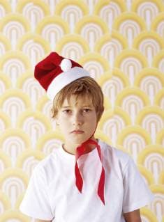 Portrait of boy in bad mood wearing Christmas cap model released Symbolfoto  FSF00977