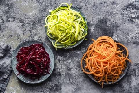 Bowl of Zoodles and bowls of carrot and beetroot spaghetti  SARF03468