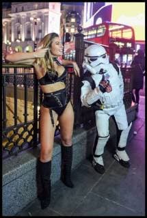. 26 02 2018. London, United Kingdom. Beast from the East - London Weather. A storm trooper photo bombs a model wearing only lingerie as she braves the freezing weather to pose for a film crew in London s Piccadilly Circus.  xPetexMaclainex xi-Imagesx IIM-17072-0002