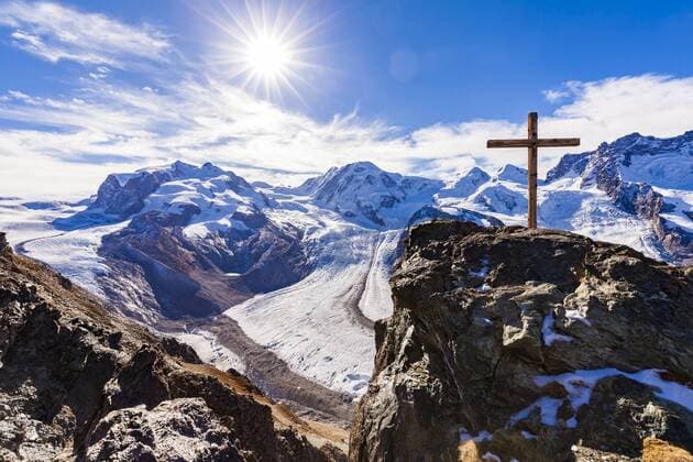 Schweiz, Kanton Wallis Switzerland, Valais, Zermatt, Monte Rosa, Monte Rosa massif, Monte Rosa Glacier, Border Glacier, Gorner Glacier, View from Gornergrat, summit cross against the sun  WDF04345