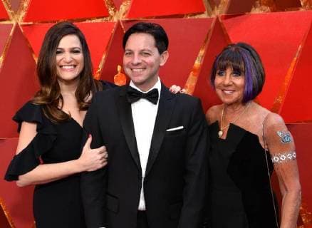 Screenwriter Scott Neustadter (R), Lauren Levy Neustadter and guest arrive on the red carpet for the 90th annual Academy Awards at the Dolby Theatre in the Hollywood section of Los Angeles on March 4, 2018.  LAP20180304492 JIMxRUYMEN