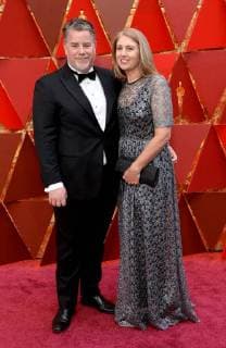 Guy Williams (L) and guest arrive on the red carpet for the 90th annual Academy Awards at the Dolby Theatre in the Hollywood section of Los Angeles on March 4, 2018.  LAP20180304944 JIMxRUYMEN