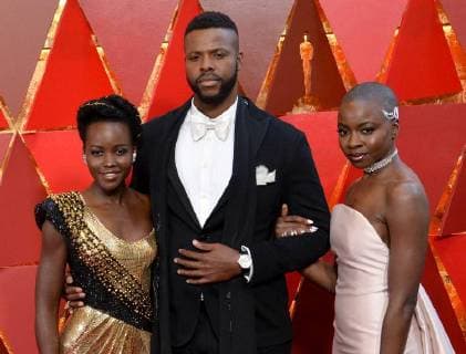 (L-R) Lupita Nyong o, Winston Duke, and Danai Gurira arrive on the red carpet for the 90th annual Academy Awards at the Dolby Theatre in the Hollywood section of Los Angeles on March 4, 2018.  LAP20180304957 JIMxRUYMEN
