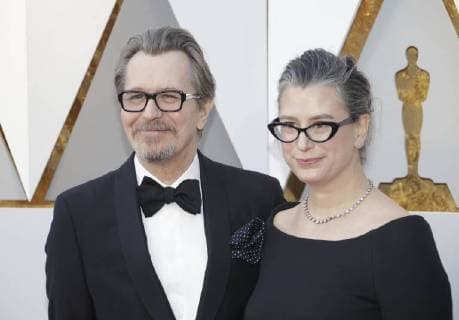 Gary Oldman and Gisele Schmidt arrive on the red carpet for the 90th annual Academy Awards at the Dolby Theatre in the Hollywood section of Los Angeles on March 4, 2018.  LAP20180304180 JOHNxANGELILLO